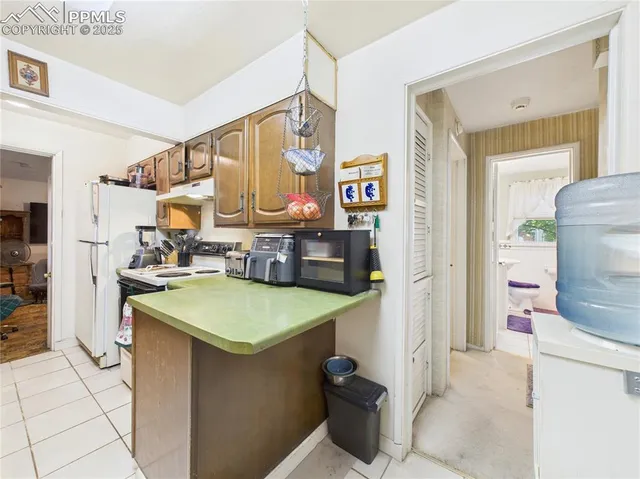 a kitchen with a sink cabinets and window