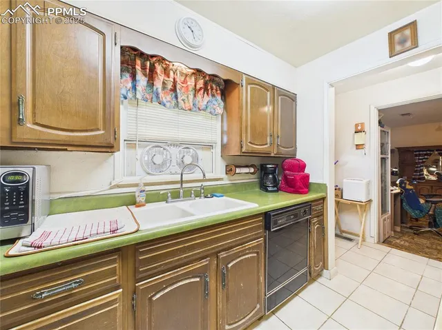 a kitchen with stainless steel appliances granite countertop a stove and a refrigerator