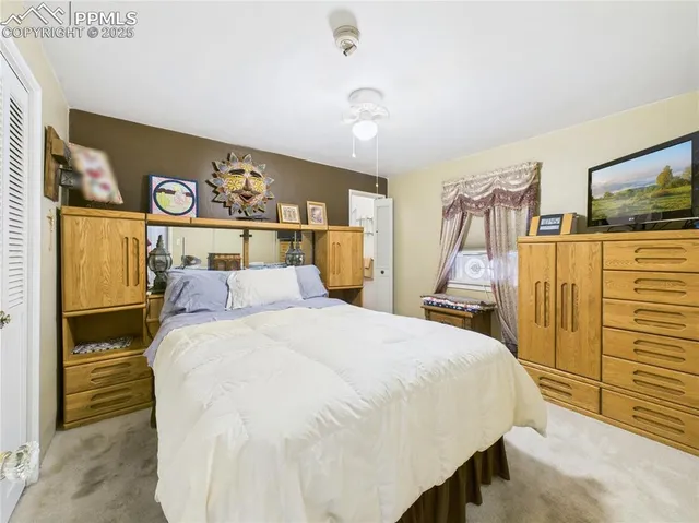 a white toilet sitting next to a shower