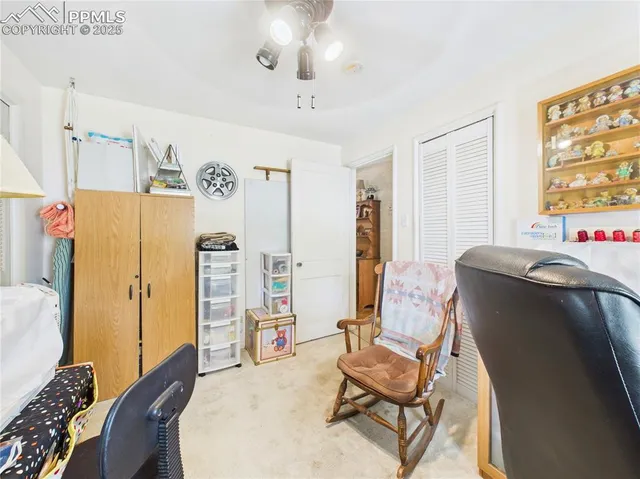 a backyard of a house with yard table and chairs