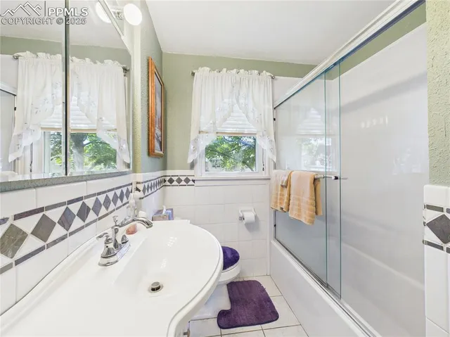 a view of a park with lawn chairs and a fire pit