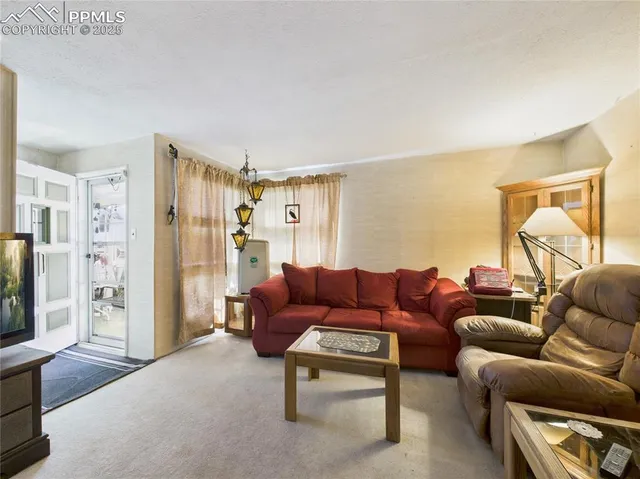 a living room with furniture and a couch