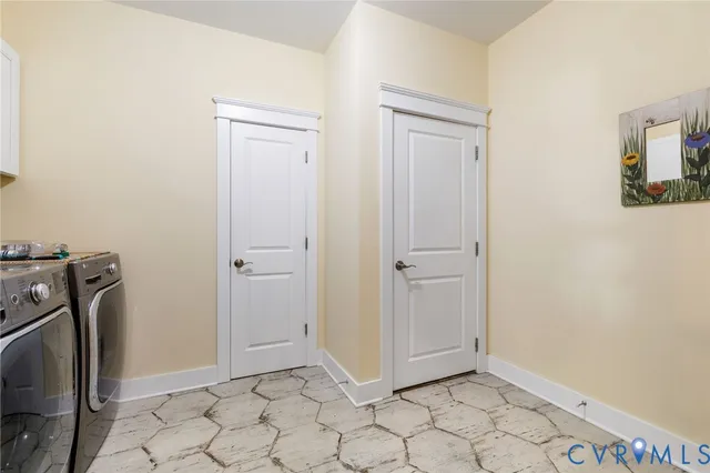 a view of a storage & utility room with a washer dryer