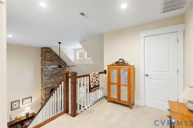 a view of a hallway with windows