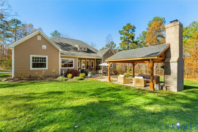 a view of a house with a yard porch and sitting area