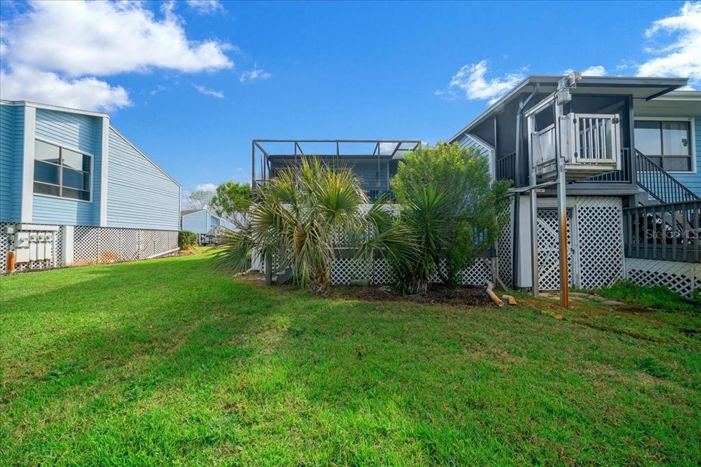 2925 North Rivers Edge Boulevard, Unit 2925 Crystal River, FL 34429 - Photo 25 of 79 a front view of a house with a yard