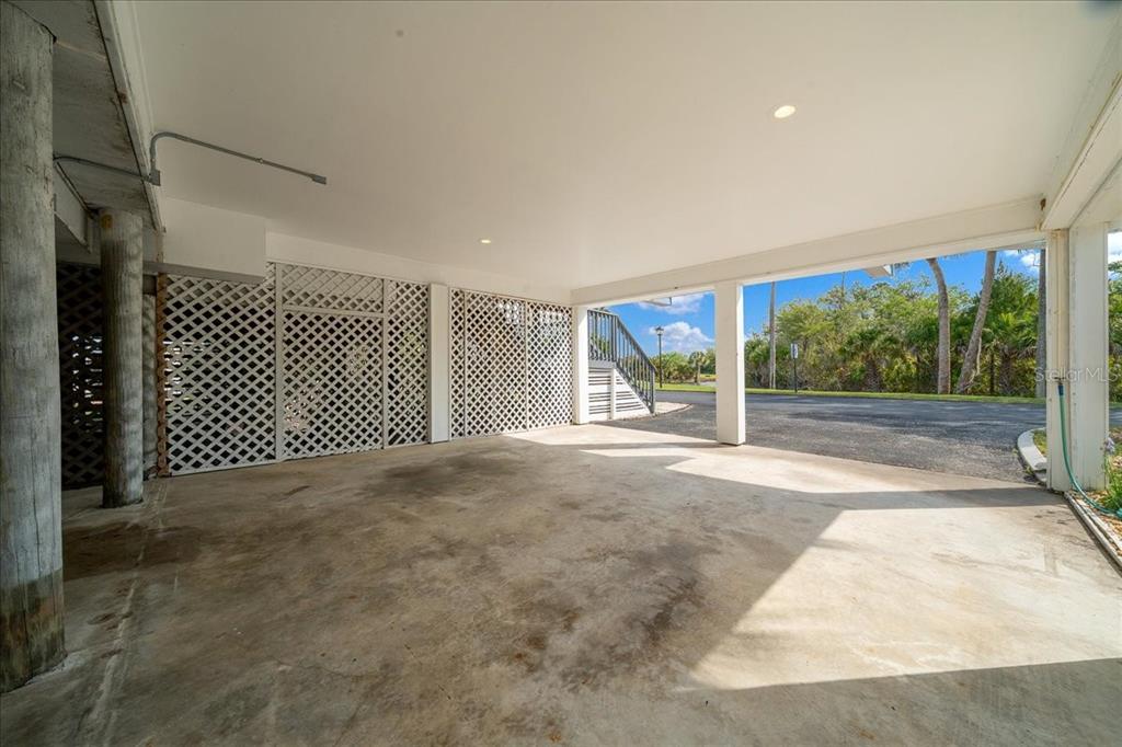 2925 North Rivers Edge Boulevard, Unit 2925 Crystal River, FL 34429 - Photo 33 of 79 a view of a room with wooden floor and iron fence