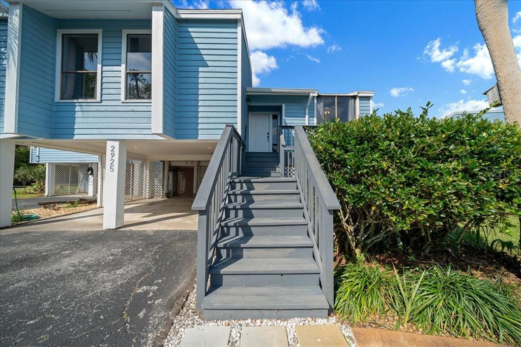 2925 North Rivers Edge Boulevard, Unit 2925 Crystal River, FL 34429 - Photo 36 of 79 a view of a house with entryway and stairs