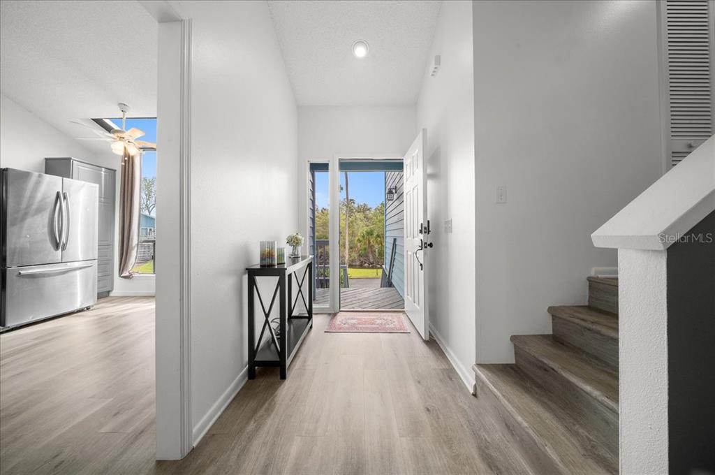 2925 North Rivers Edge Boulevard, Unit 2925 Crystal River, FL 34429 - Photo 37 of 79 a view of a hallway with wooden floor and staircase