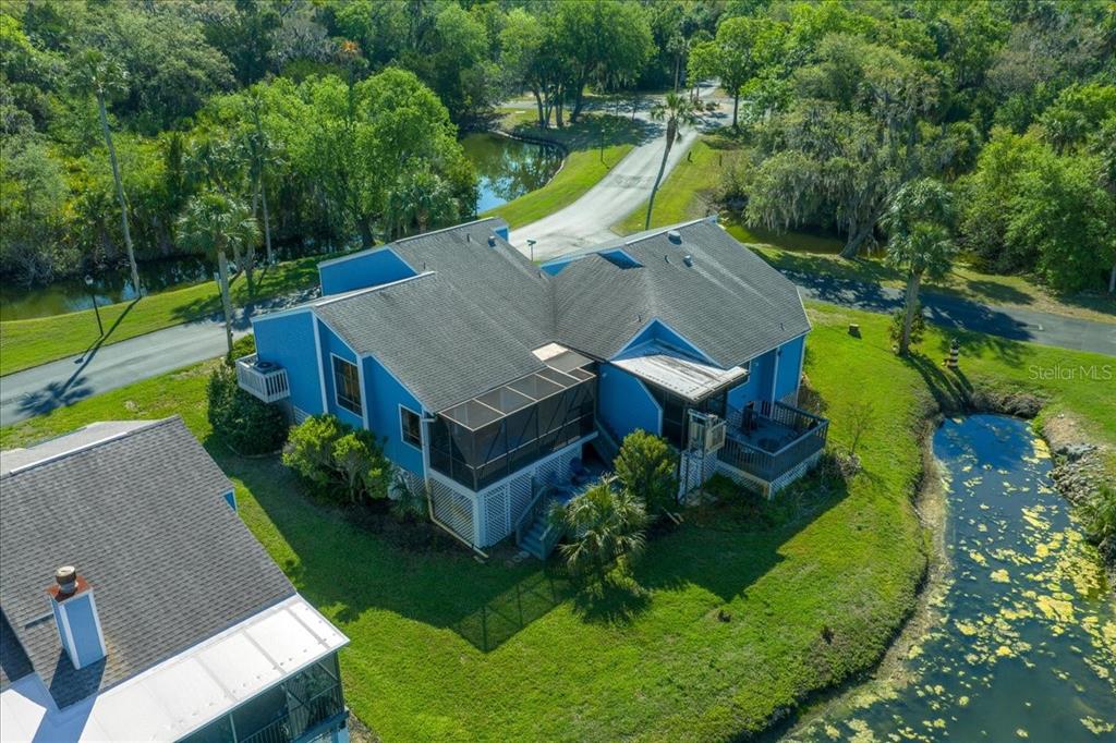 2925 North Rivers Edge Boulevard, Unit 2925 Crystal River, FL 34429 - Photo 52 of 79 an aerial view of a house with swimming pool and garden view