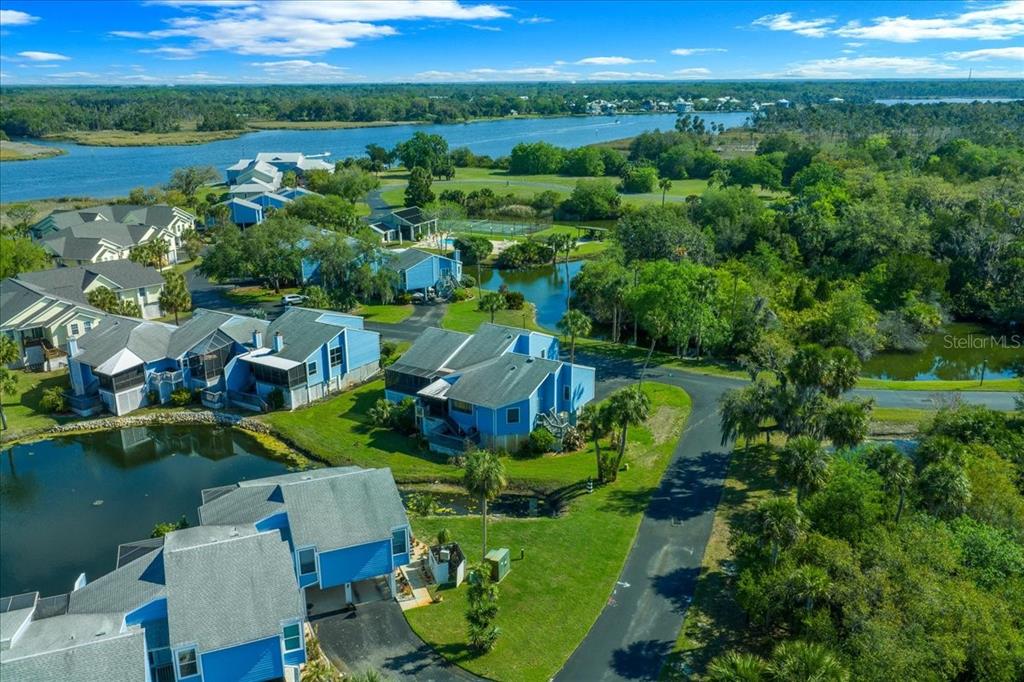 2925 North Rivers Edge Boulevard, Unit 2925 Crystal River, FL 34429 - Photo 57 of 79 an aerial view of a house with a garden and lake view