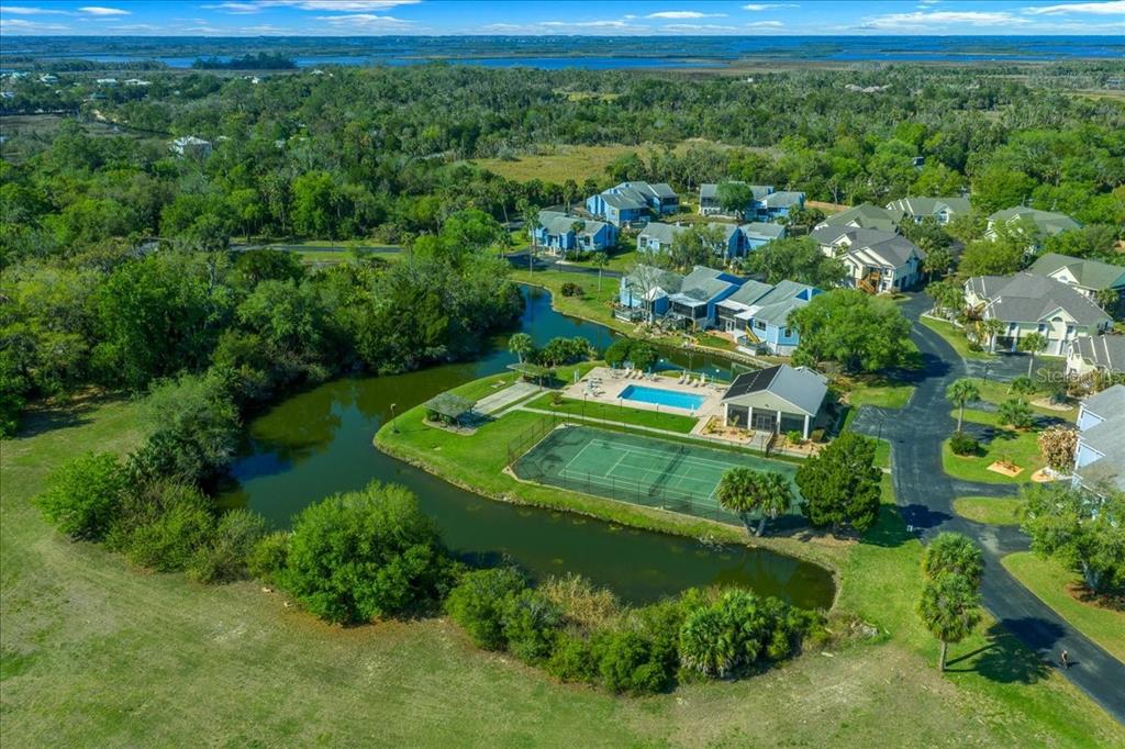 2925 North Rivers Edge Boulevard, Unit 2925 Crystal River, FL 34429 - Photo 60 of 79 a view of a garden with a building in the background