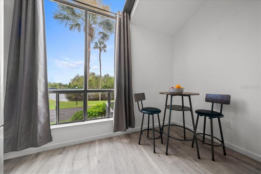 2925 North Rivers Edge Boulevard, Unit 2925 Crystal River, FL 34429 - Photo 63 of 79 a view of a livingroom with furniture window and wooden floor
