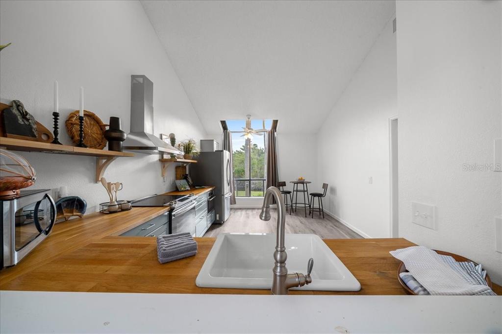 2925 North Rivers Edge Boulevard, Unit 2925 Crystal River, FL 34429 - Photo 67 of 79 a living room with furniture and a wooden floor