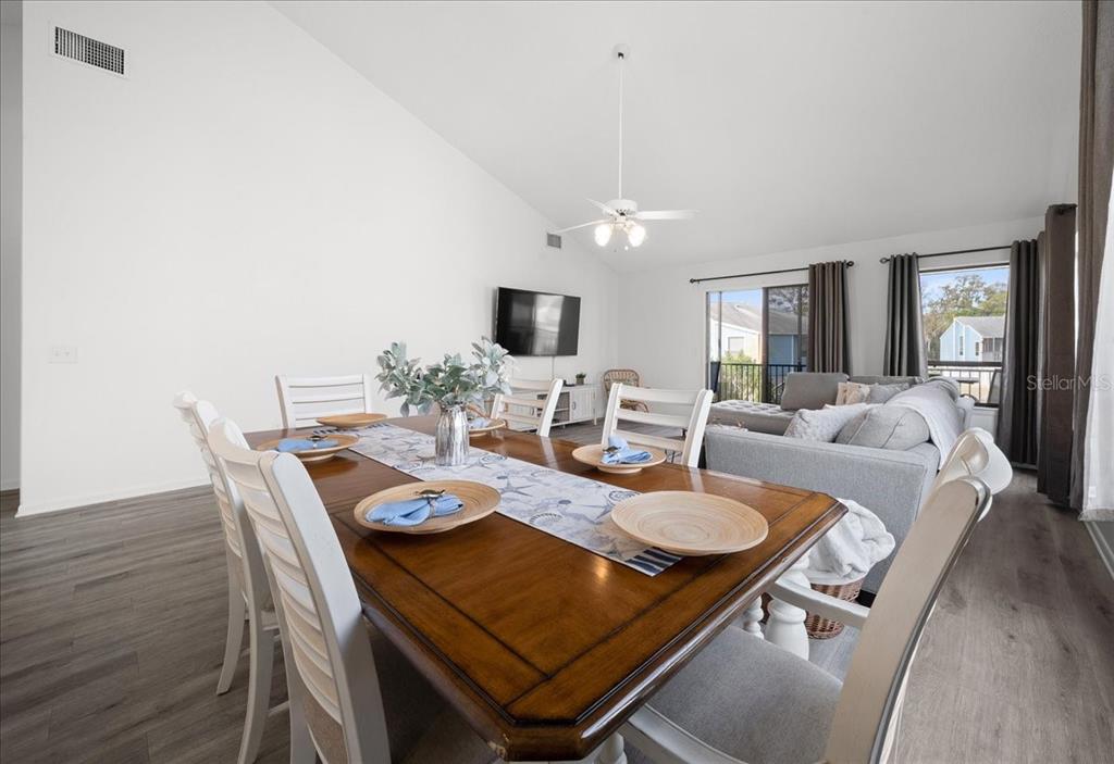 2925 North Rivers Edge Boulevard, Unit 2925 Crystal River, FL 34429 - Photo 68 of 79 a view of a dining room with furniture and wooden floor
