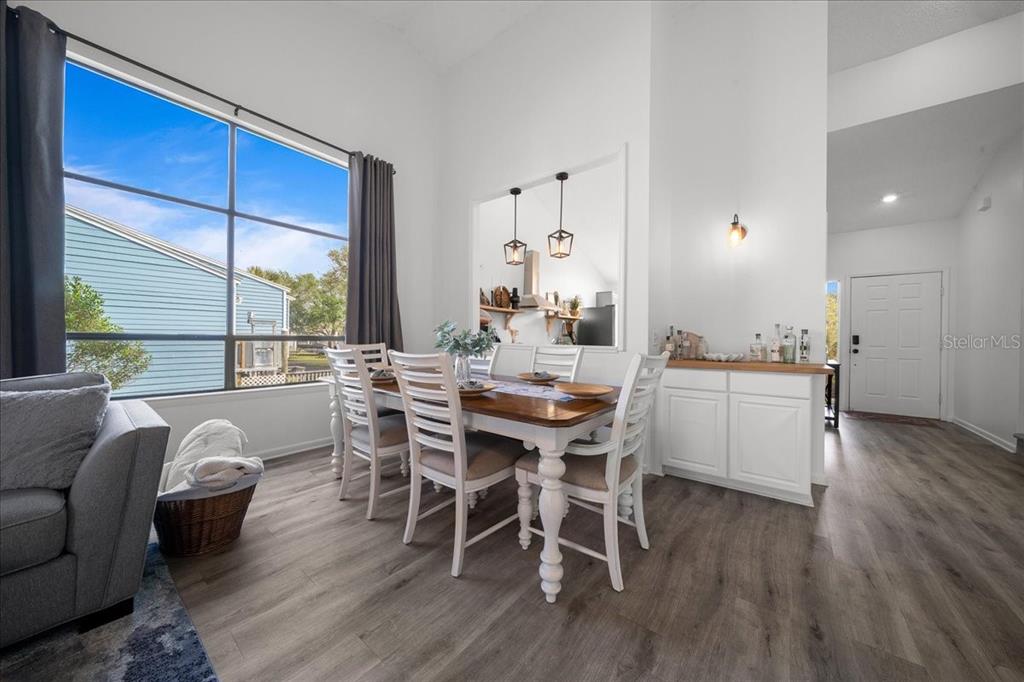 2925 North Rivers Edge Boulevard, Unit 2925 Crystal River, FL 34429 - Photo 69 of 79 a view of a dining room with furniture window and wooden floor