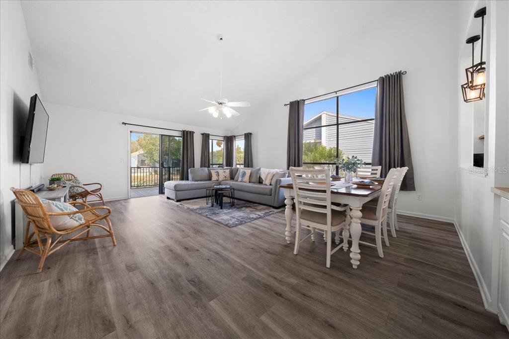 2925 North Rivers Edge Boulevard, Unit 2925 Crystal River, FL 34429 - Photo 70 of 79 a living room with furniture and a wooden floor