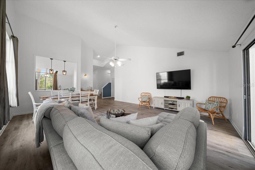 2925 North Rivers Edge Boulevard, Unit 2925 Crystal River, FL 34429 - Photo 72 of 79 a living room with furniture and a flat screen tv