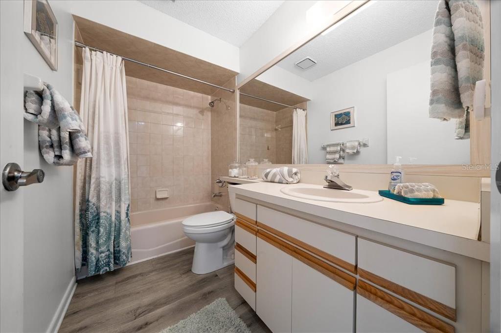 2925 North Rivers Edge Boulevard, Unit 2925 Crystal River, FL 34429 - Photo 10 of 79 a bathroom with a sink a toilet and shower