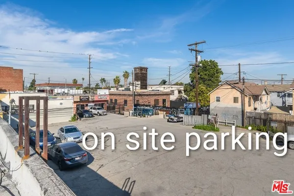 a view of a street with parking