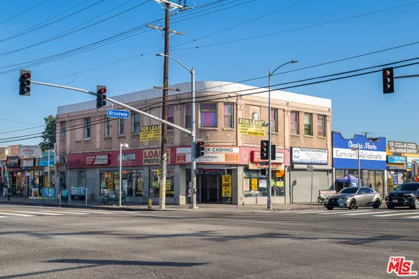 a view of a food mall next to a road