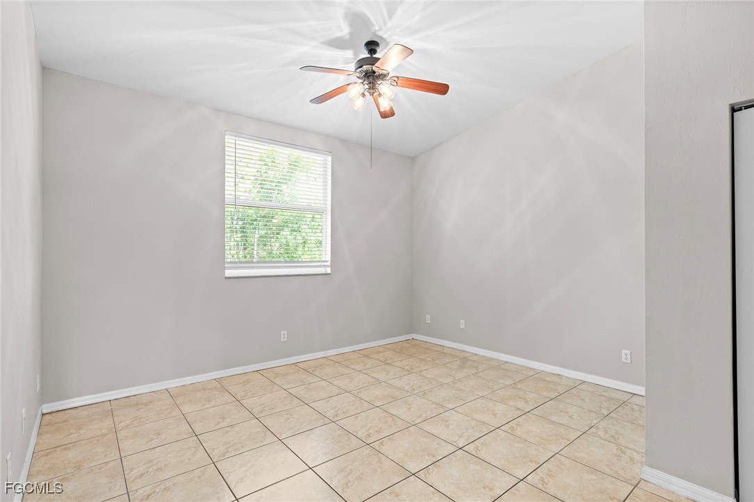 4191 Bellasol Circle, Unit 521 Fort Myers, FL 33916 - Photo 17 of 22 a view of a room with window and ceiling fan
