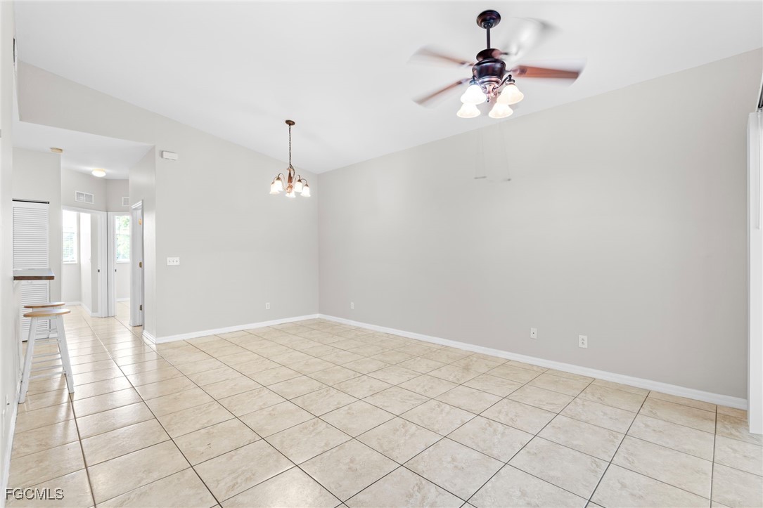 4191 Bellasol Circle, Unit 521 Fort Myers, FL 33916 - Photo 19 of 22 a view of an empty room and chandelier fan