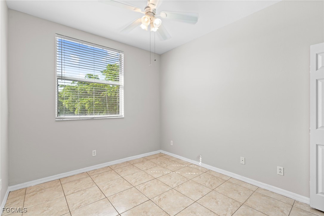 4191 Bellasol Circle, Unit 521 Fort Myers, FL 33916 - Photo 9 of 22 an empty room with windows