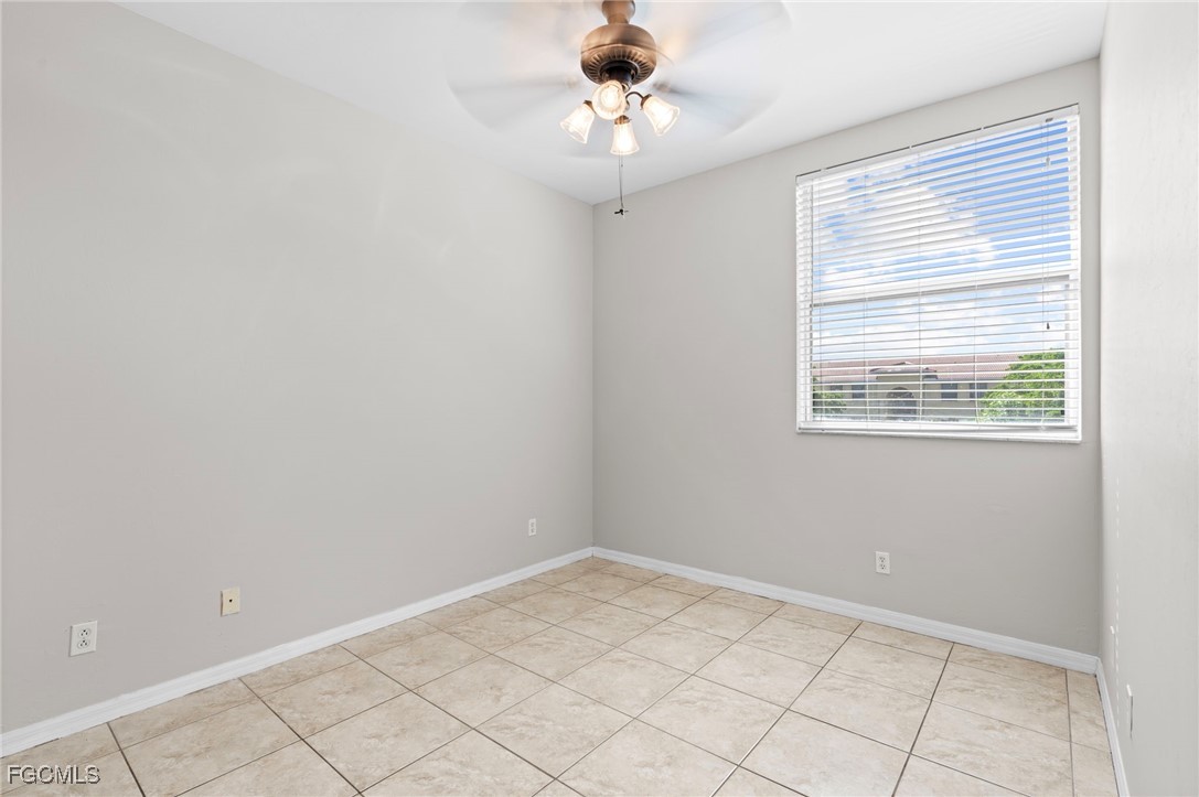 4191 Bellasol Circle, Unit 521 Fort Myers, FL 33916 - Photo 10 of 22 a view of an empty room with a window