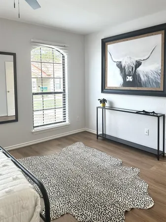 a bathroom with a double vanity sink toilet and shower