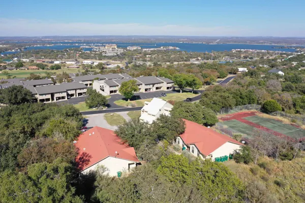 an aerial view of a house with a yard