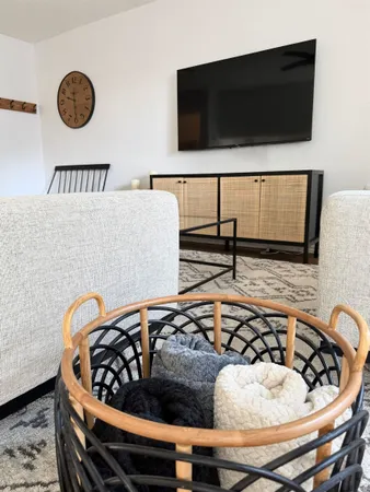 a bedroom with a bed and flat screen tv