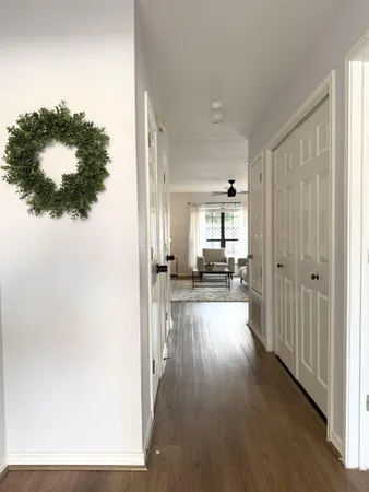 a view of a house and wooden floor