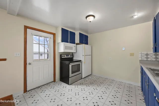 a view of a hallway with a room