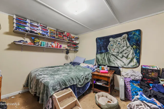 a backyard of a house with barbeque oven table and chairs