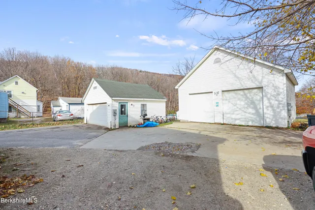 a view of a car park in front of house