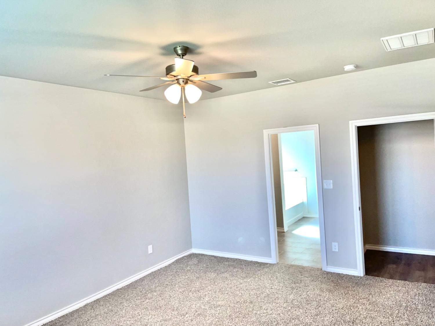 7729 96th Street Lubbock, TX 79424 - Photo 11 of 35 a view of a chandelier fan in a room