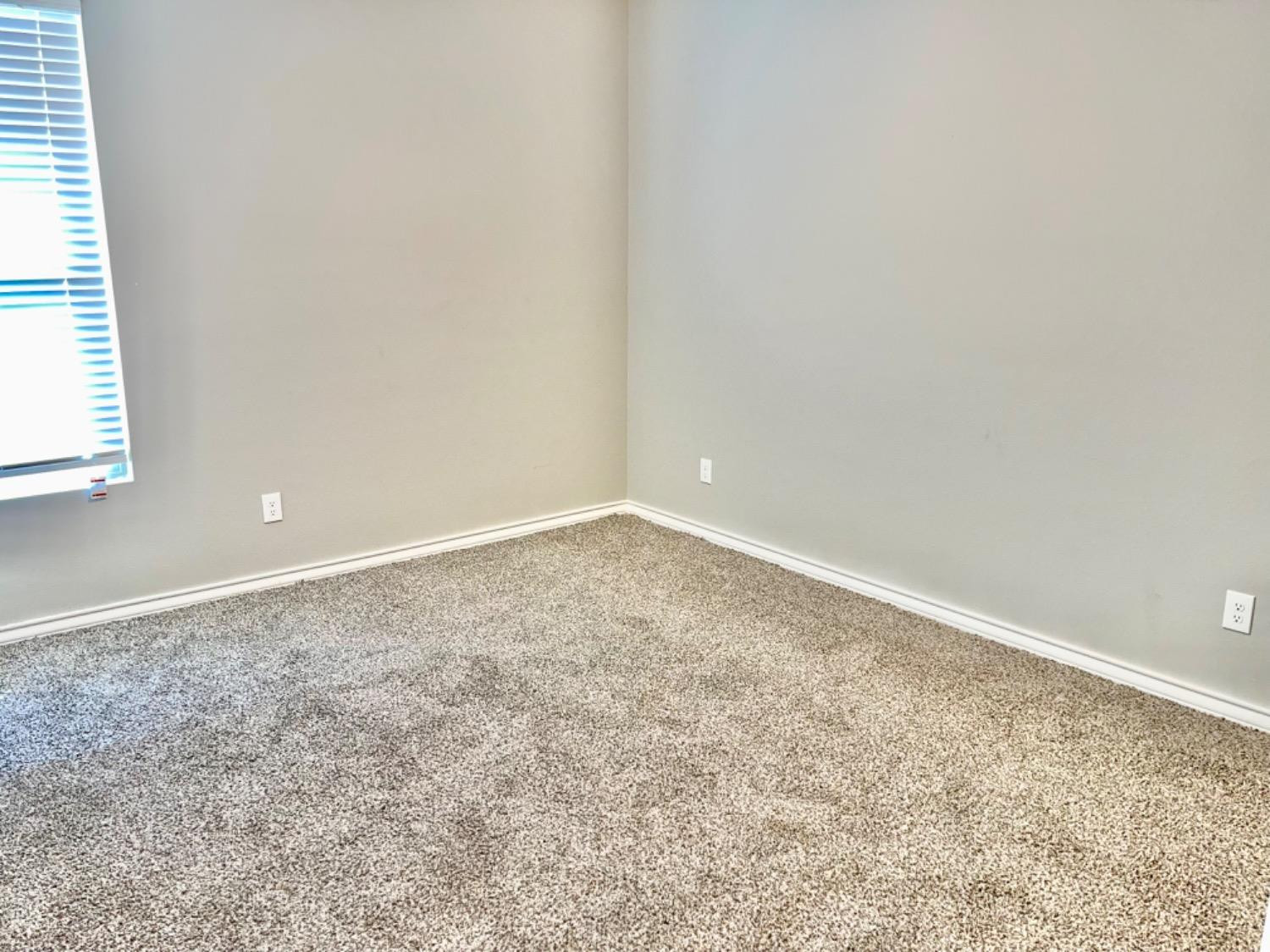 7729 96th Street Lubbock, TX 79424 - Photo 21 of 35 an empty room with a workbench