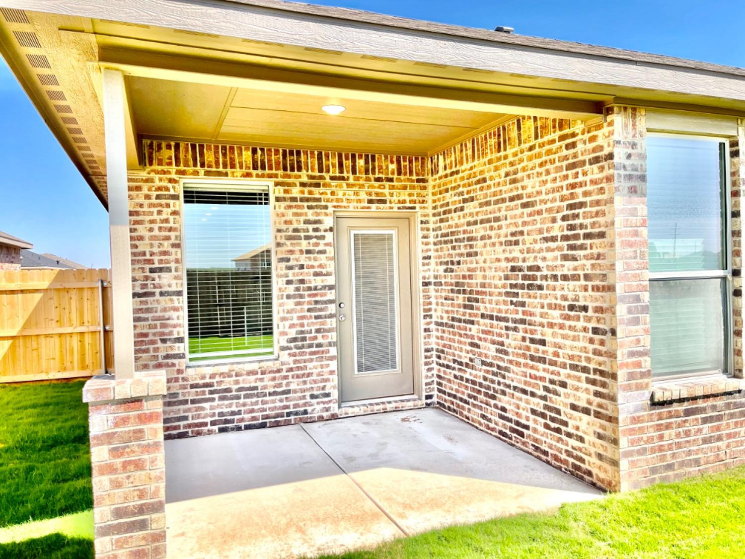 7729 96th Street Lubbock, TX 79424 - Photo 34 of 35 a front view of a house with a garage