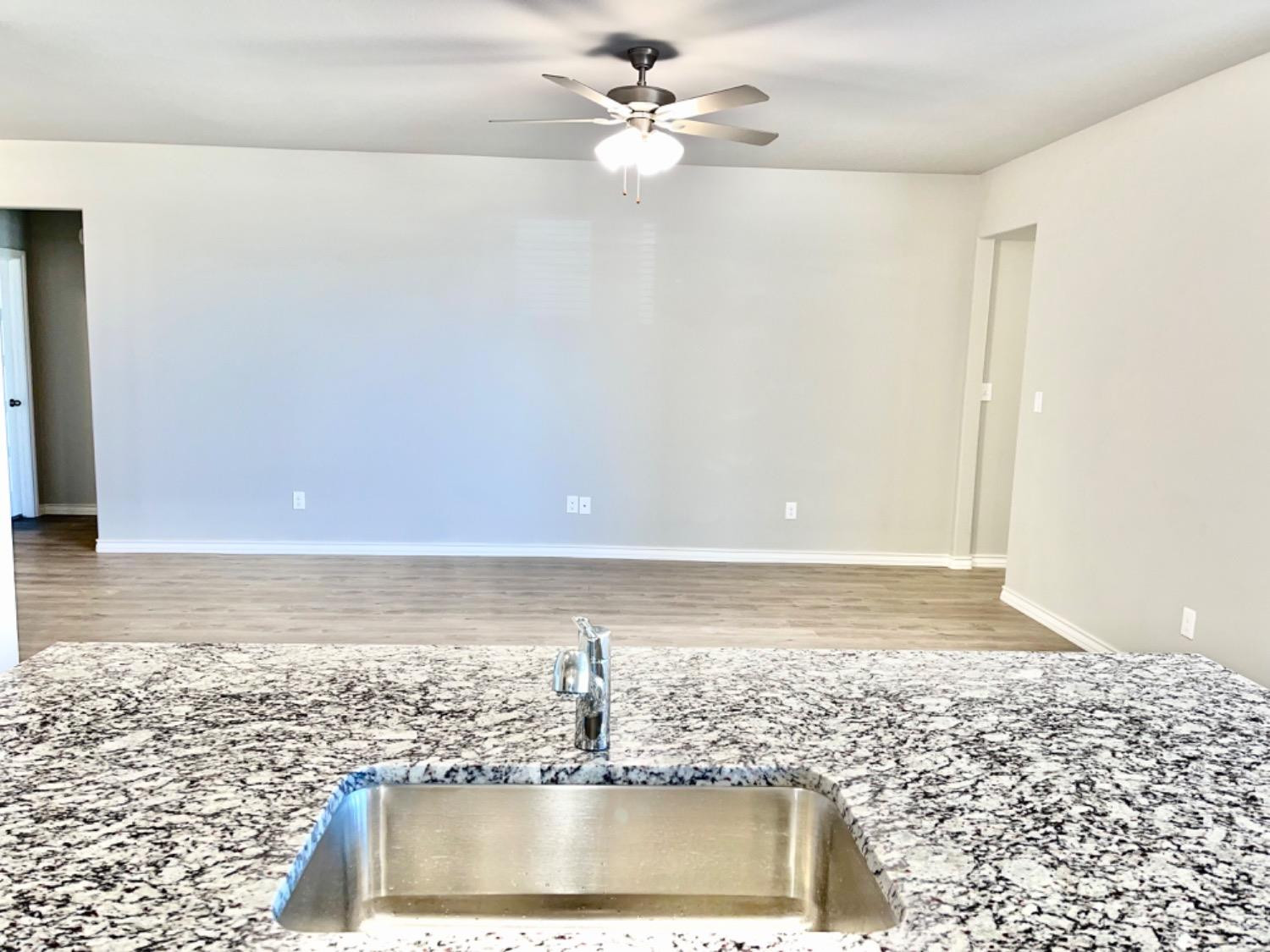 7729 96th Street Lubbock, TX 79424 - Photo 10 of 35 a view of a water heater room