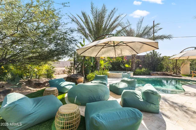 a view of a table and chair in the garden