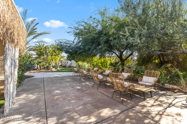 a backyard of a house with lots of green space and garden