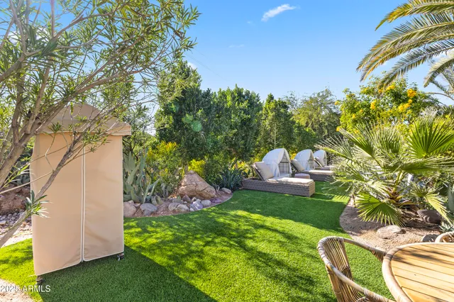 a view of a chair and table in a yard