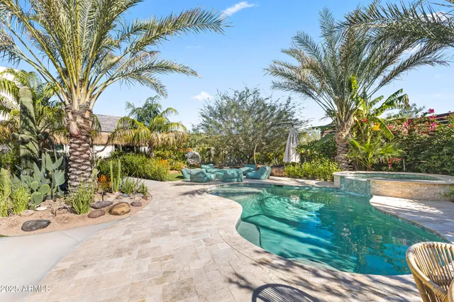 a view of a table and chairs under an umbrella