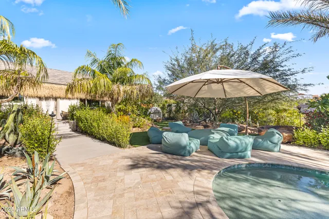a view of a backyard with sitting area and furniture