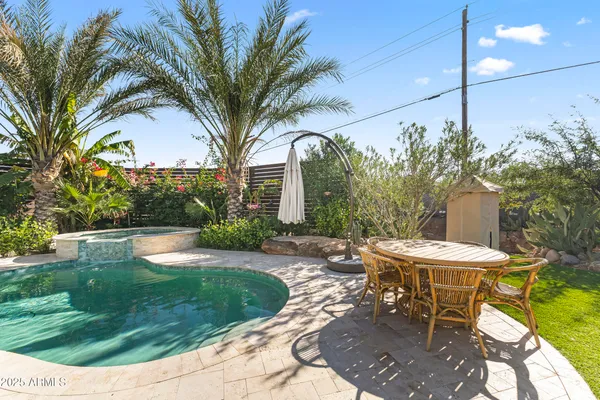 a view of a backyard with sitting area