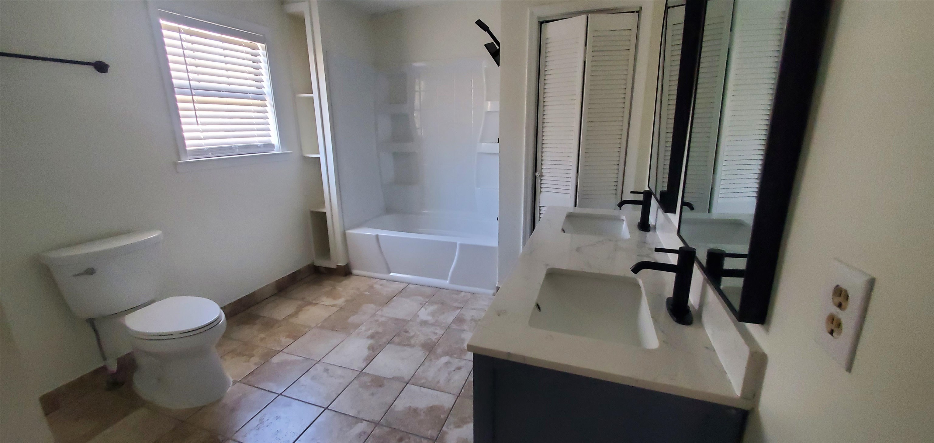 5352 Virgil Road Bartlett, TN 38134 - Photo 16 of 21 a bathroom with a sink toilet and shower