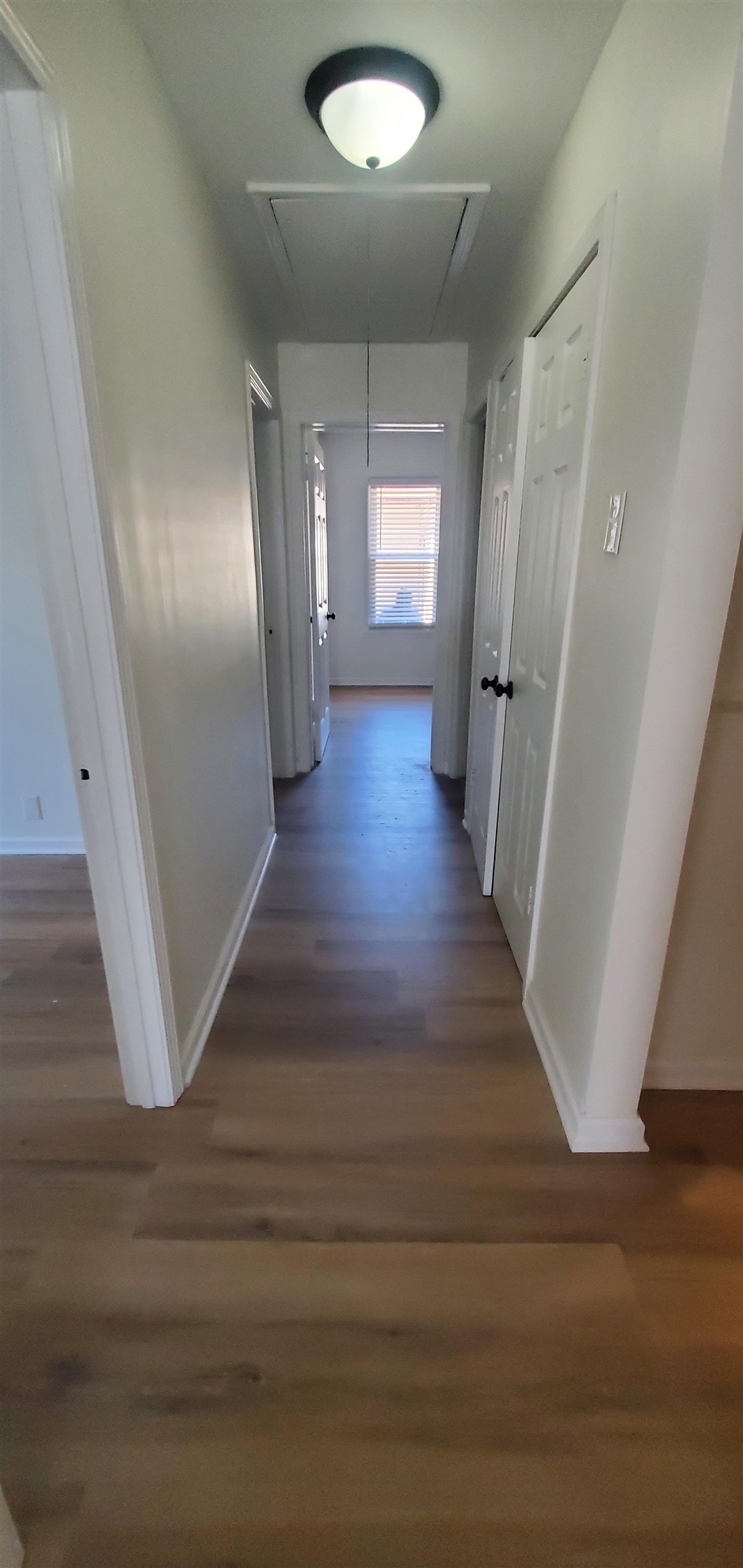 5352 Virgil Road Bartlett, TN 38134 - Photo 10 of 21 a view of a hallway with wooden floor and staircase