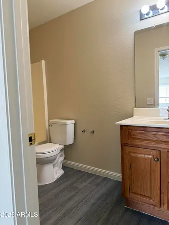 a bathroom with a toilet and a sink