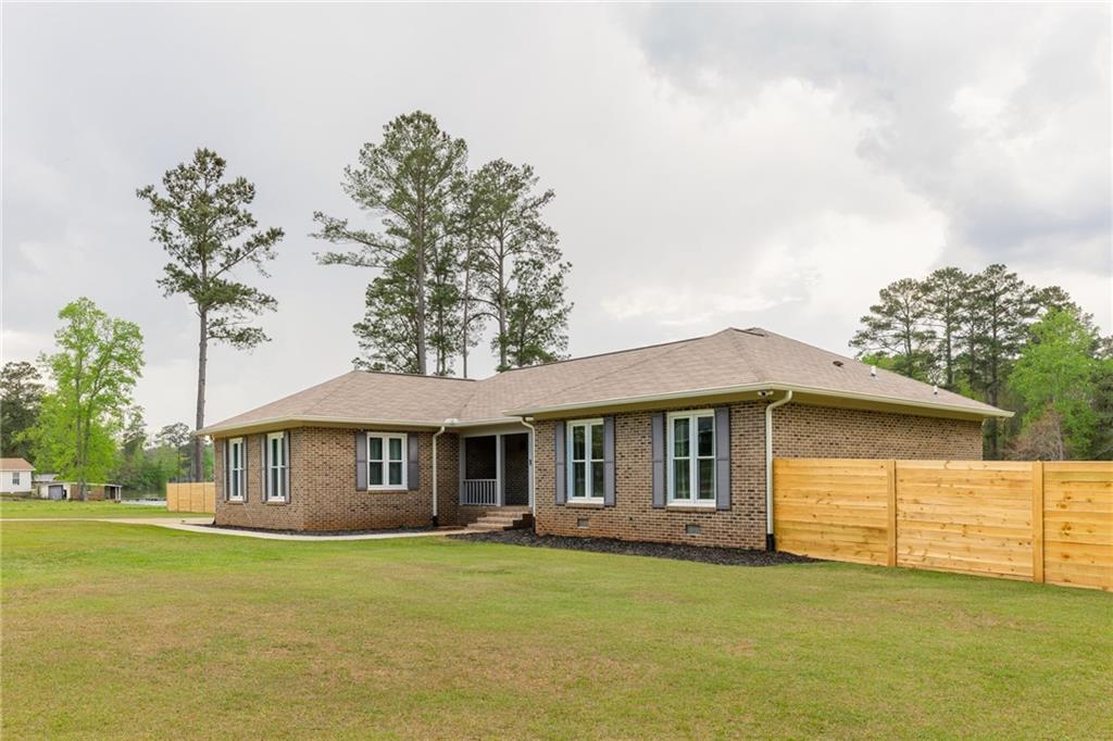 434 Rawley Road Americus, GA 31719 - Photo 3 of 50 a front view of a house with a garden